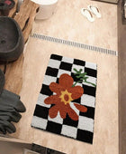 Geruit Vloerkleed met Oranje Bloemenaccent